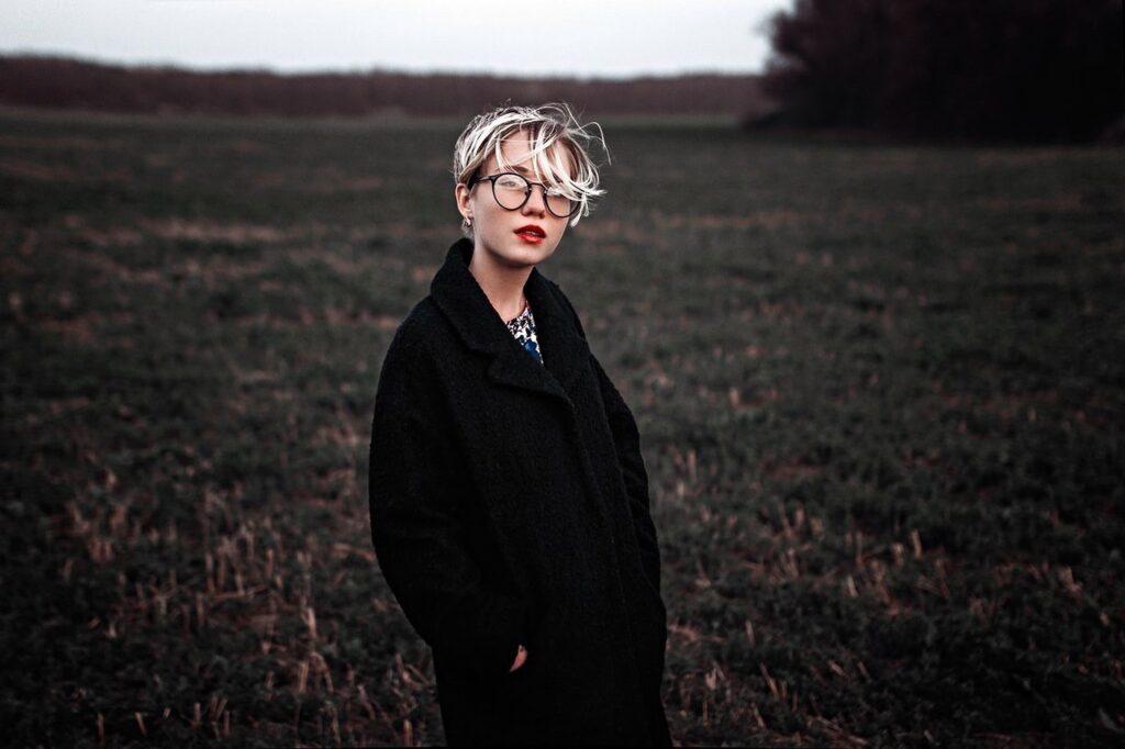 A woman standing in a field.