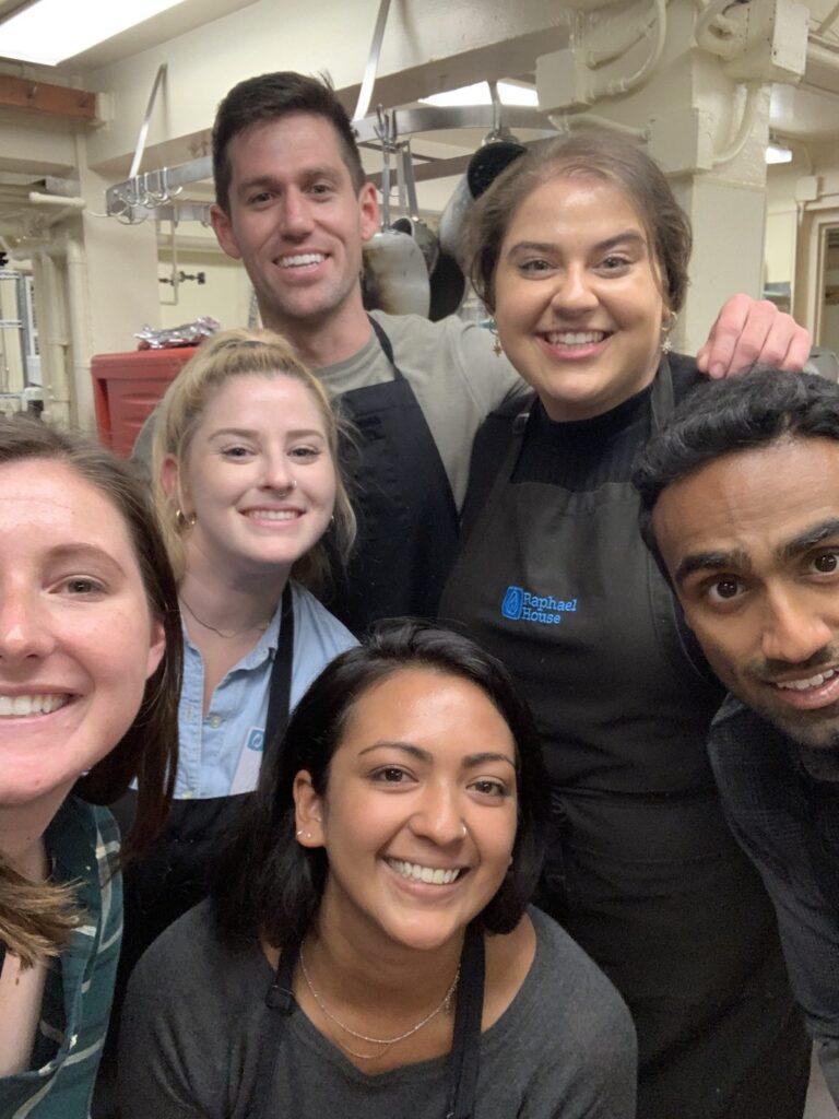 Canto Cares volunteers help prep a meal for families in need at Raphael House