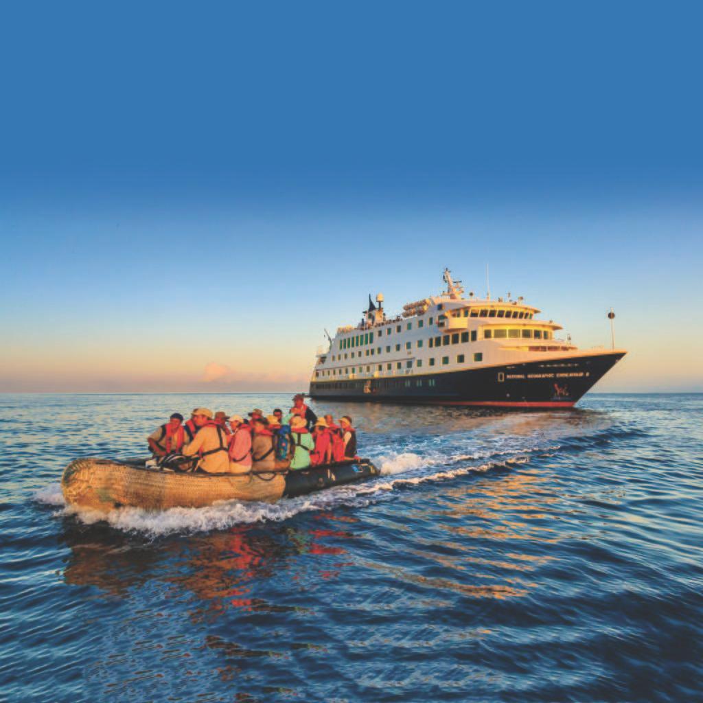 Photo of a cruise ship and passengers on a motor raft.
