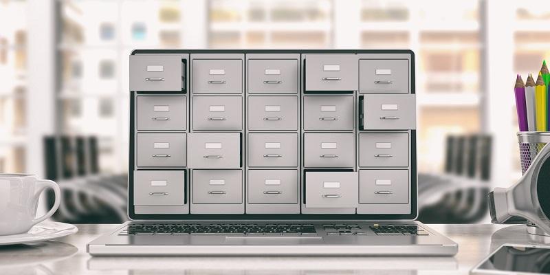 A laptop with drawers coming out of the screen.