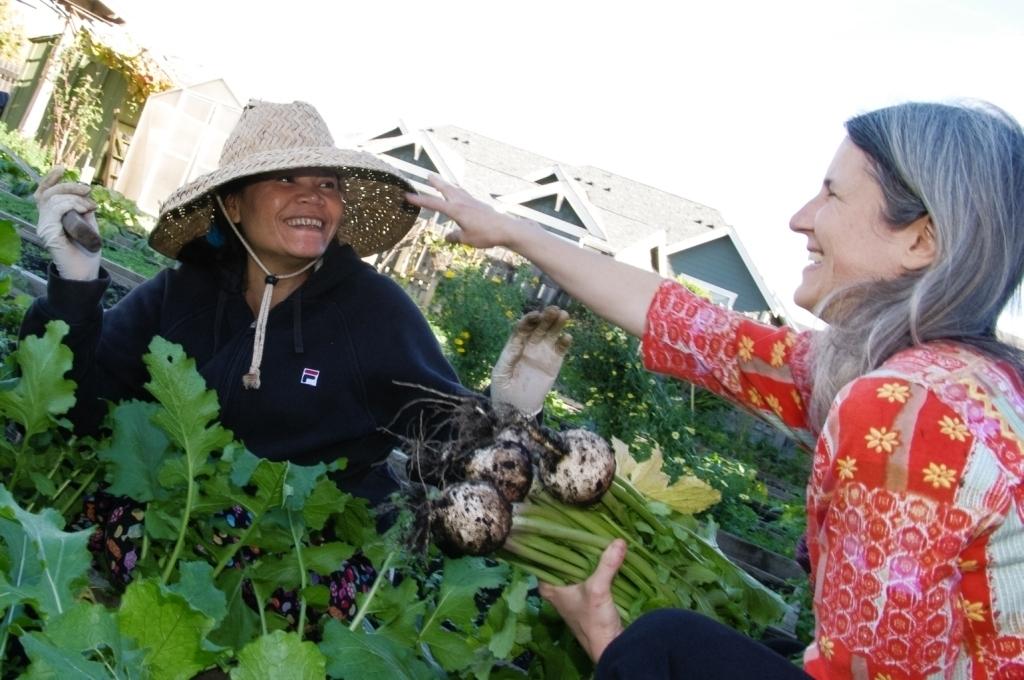 Photo of a woman working in a garden.