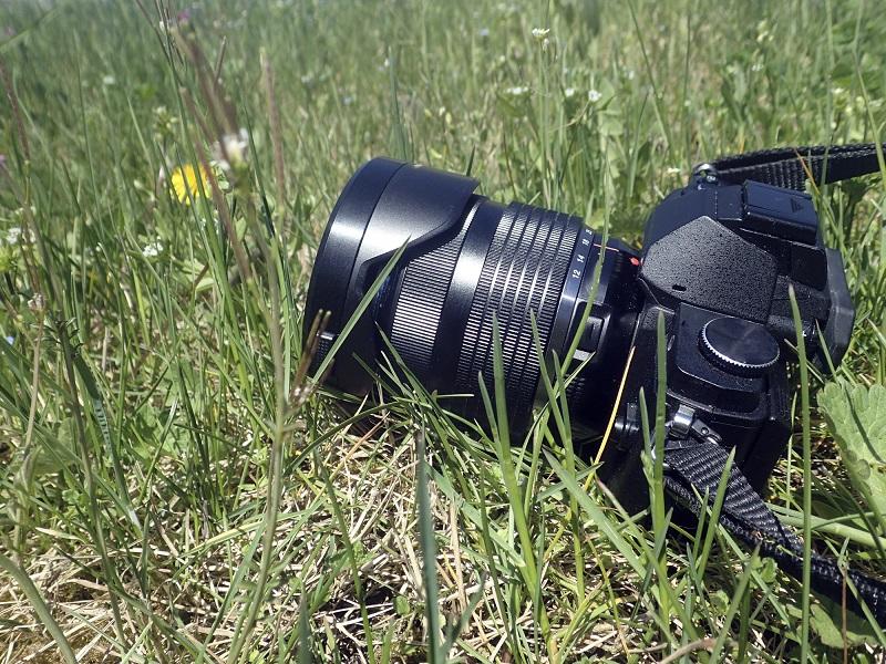 A camera in a grass field.