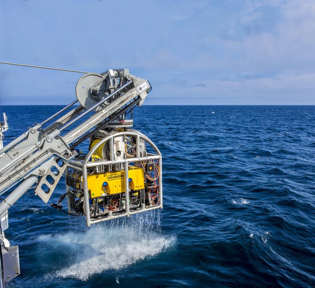 Photo of equipment being hauled abord a ship.