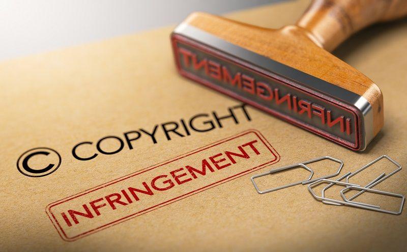 Ein Gummistempel mit dem Wort 'Verletzung' für das Bildcopyright.