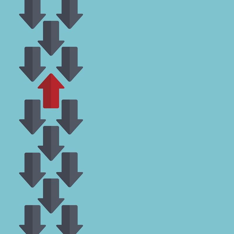 Arrows going in the same direction, except for one.