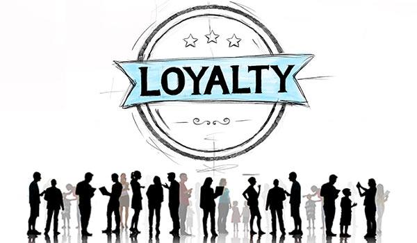 A picture of people with a sign above them that reads 'loyalty'.
