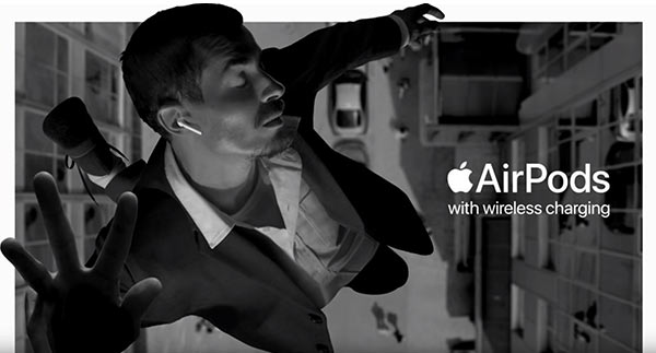 A man floating while listening to earbuds.