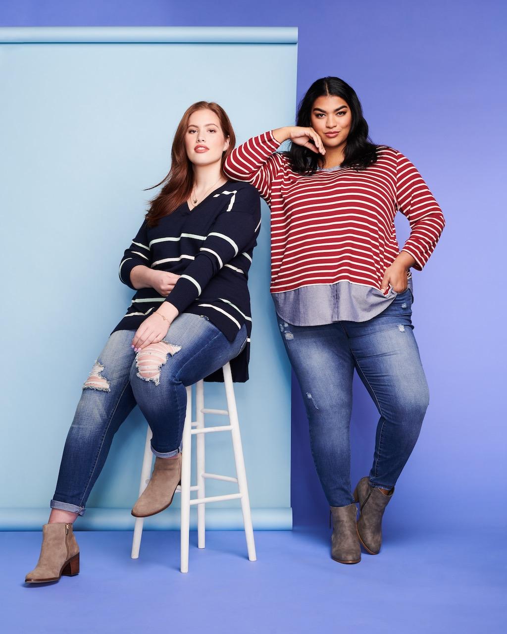 Two plus size models posing.