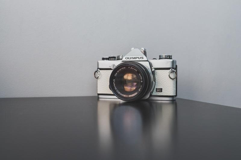 An Olympus camera on a desk.