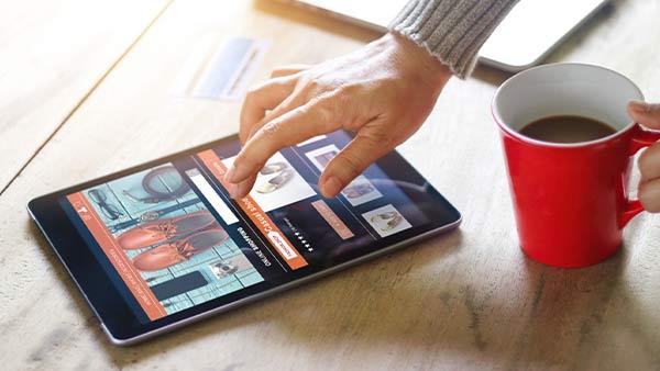 A person browsing a website on a tablet.