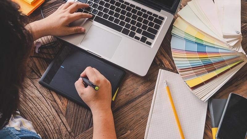 A designer uses an electronic writing pad.