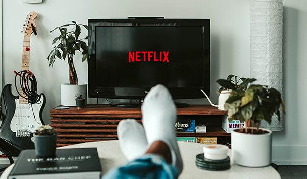 A picture of a person watching Netflix.