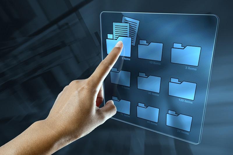 A hand selecting a digital folder.