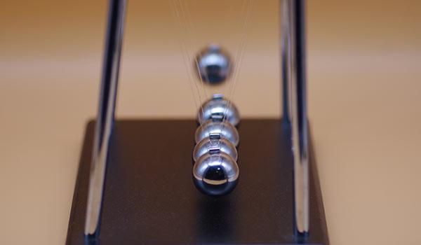 A swinging pendulum.