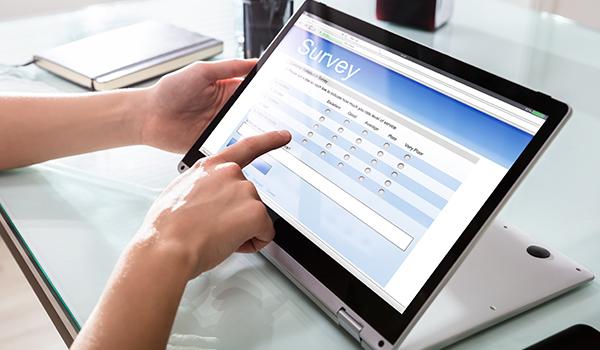 A person taking an on-screen survey.