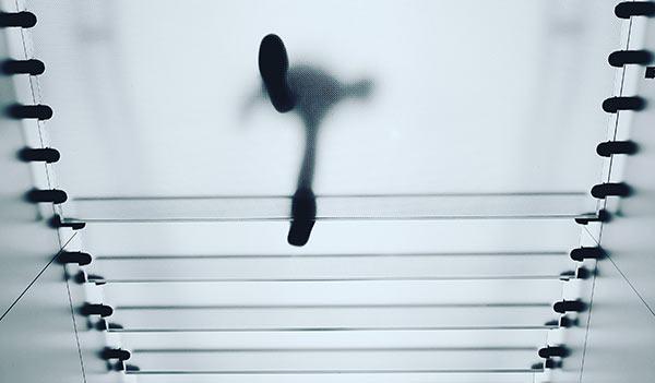 A person walking on a transparent platform.
