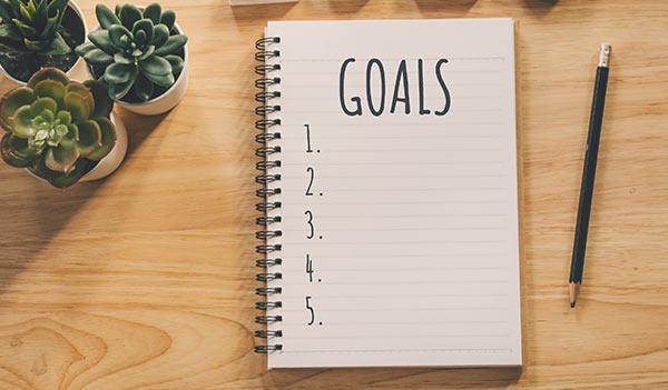A notepad for writing down goals.