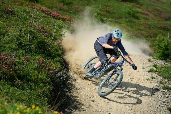 A person riding a bike downhill.