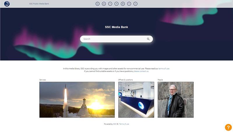 Screenshot of the Swedish Space Corporation public Media Bank portal. The banner features Northern Lights of blue and purple against a dark blue sky, with the SSC Media Bank title and a search bar overtop. There are different categories external teams can choose to download from, such as Services, Offices & Locations, and People, each containing digital assets approved by SSC.