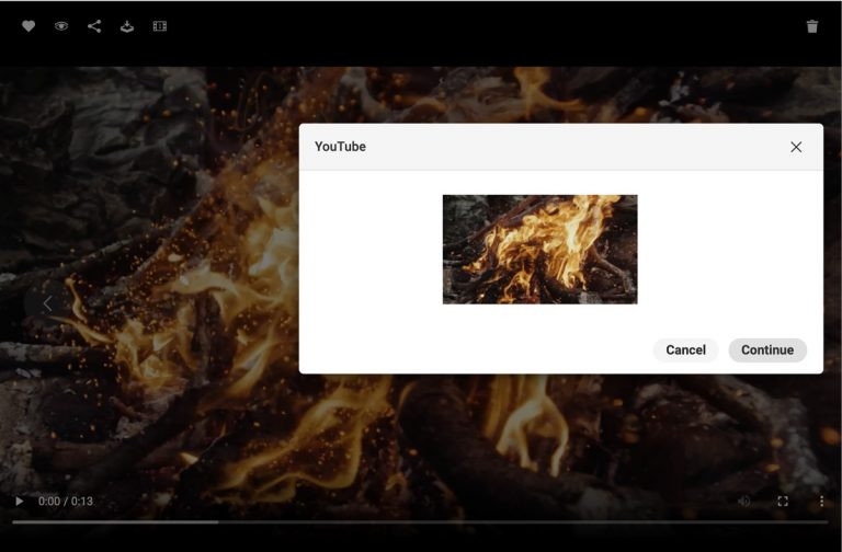 Screenshot der Benutzeroberfläche des DAM-Systems von Canto, der ein Video-Asset mit einem brennenden Feuer in der Detailansicht zeigt, überlagert von einem Dialogfeld, das zur Freigabe des Assets auf Youtube dient.