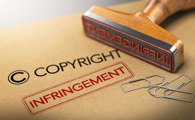 Ein Gummistempel mit dem Wort 'Verletzung' für das Bildcopyright.