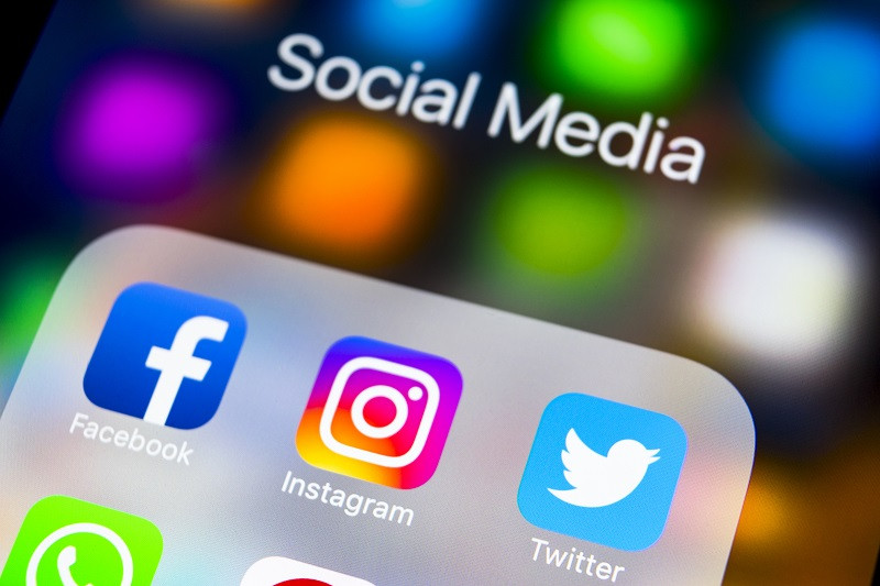 A mobile device with social media icons on it.