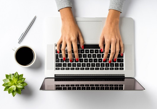 A woman seeks photo organization tools online.