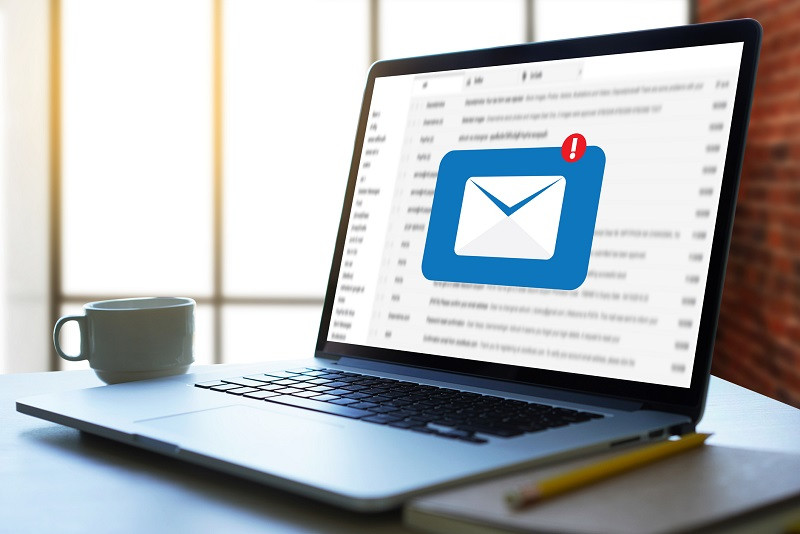 A laptop using email.