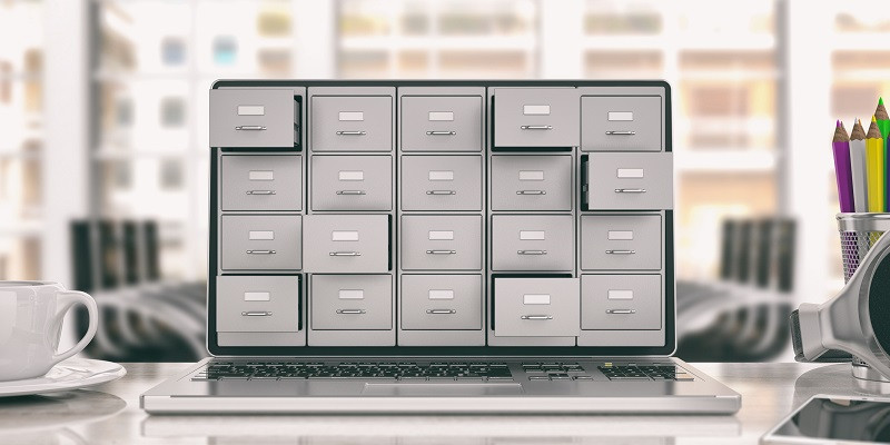 A laptop with drawers coming out of the screen.