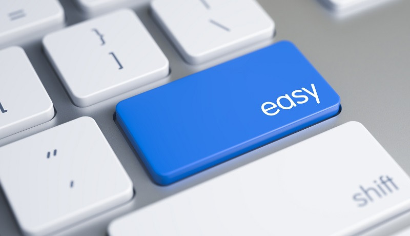 A zoomed in view of a keyboard but the 'return' key has been swapped with a key that reads "easy"