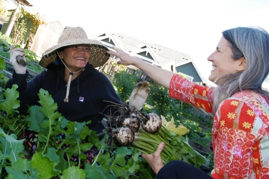 Photo of a woman working in a garden.