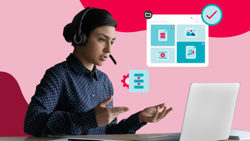 A woman in a blue shirt and headset on looks at her computer blue illustrated icons of a dam library, system workflow and a check mark float above her all over a red background