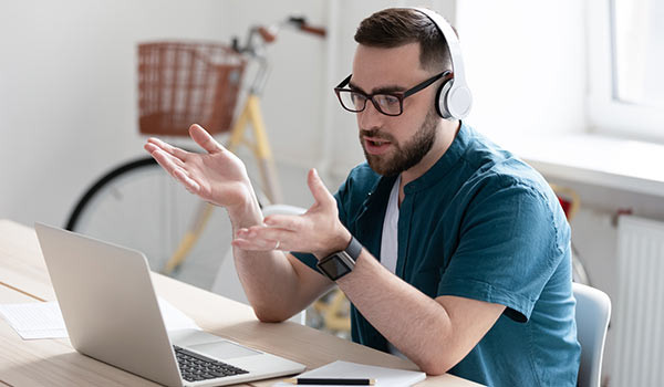 A man on a laptop.