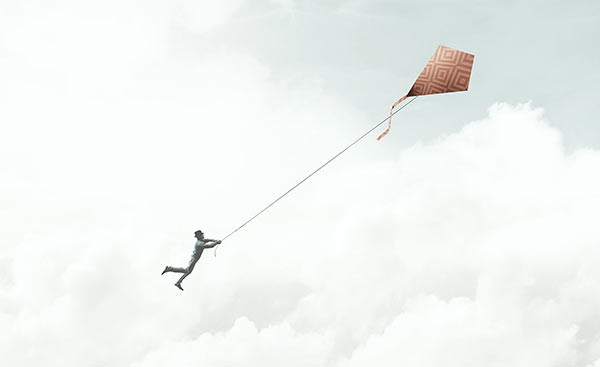 A person losing control of a kite.