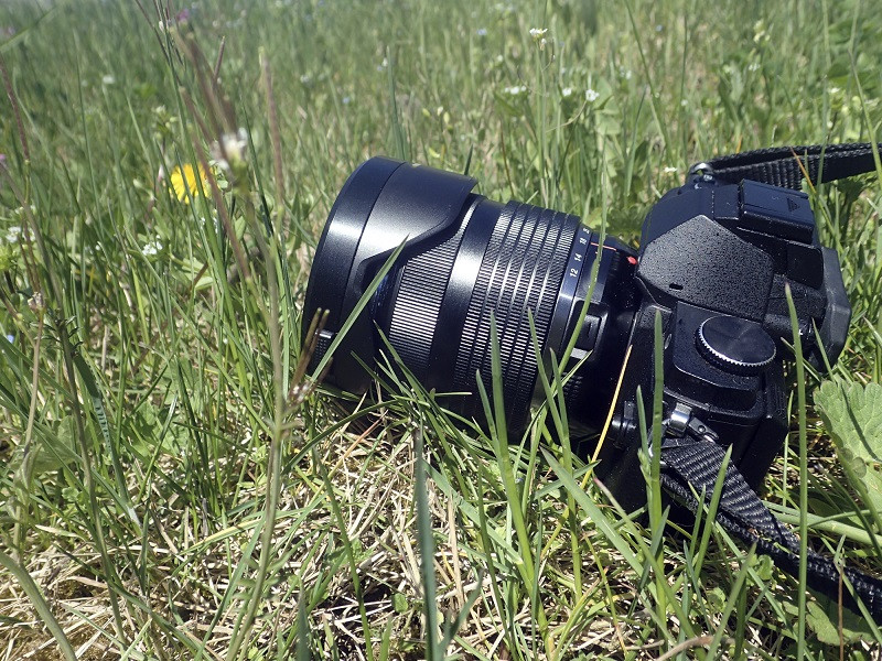 A camera in a grass field.