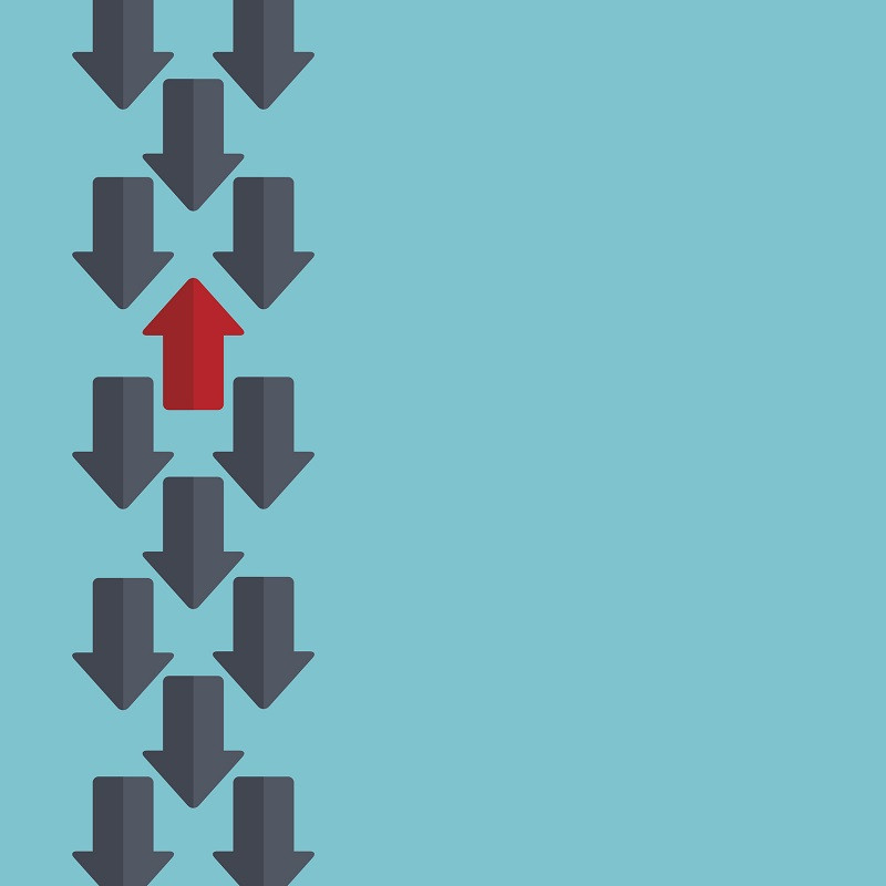 Arrows going in the same direction, except for one.