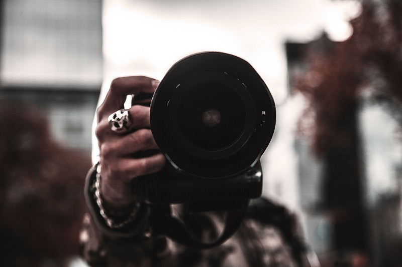 A man holding a camera.