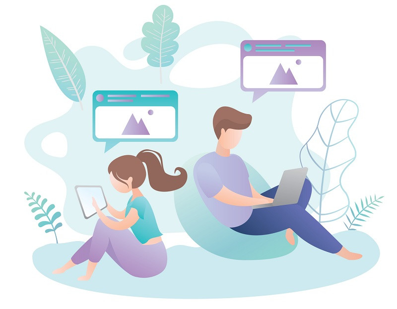 Two young people on laptops.
