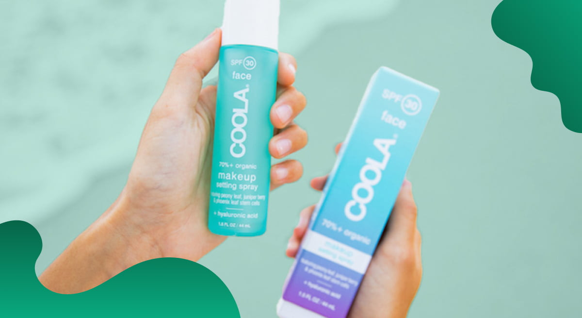 COOLA Suncare header image in green showing someone holding suncare products on a beach.
