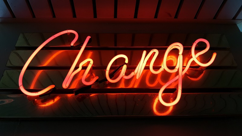 A neon sign that reads 'change'.