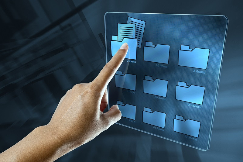 A hand selecting a digital folder.
