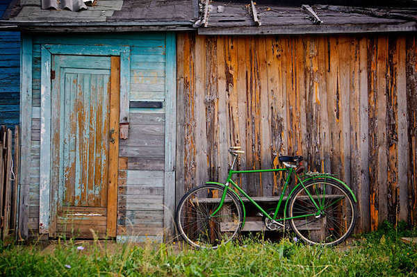 a green bike and shed