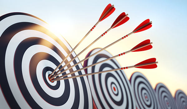A target with an arrow in it.