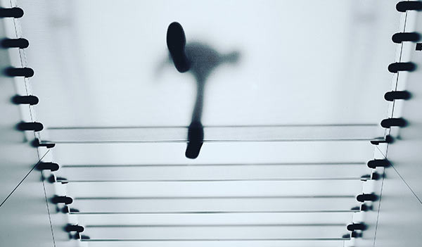 A person walking on a transparent platform.