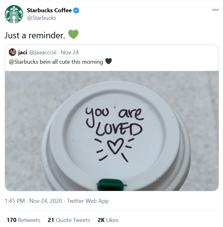 A Starbucks coffee cup lid with writing on it.