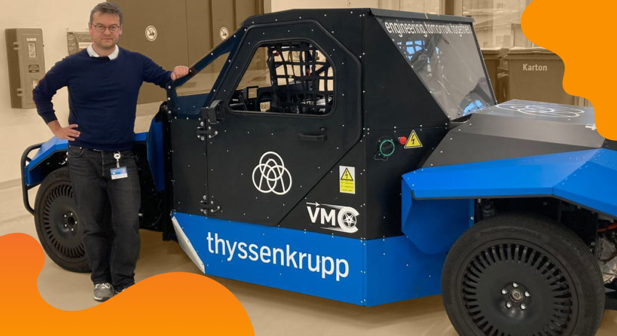 thyssenkrupp header image in orange of conceptional vehicle.
