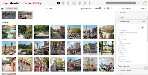 I Am Amsterdam's media library filled with images of buildings with the search filter bar to find images.