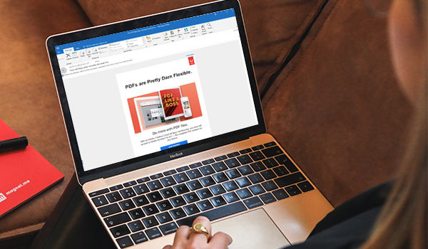 Marketing email from Adobe on a laptop screen.