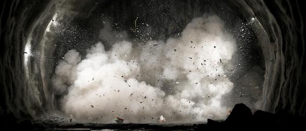 an image of a cave explosion with smoke and debris