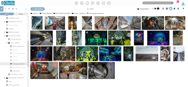 Ghella's digital asset mangement library, with the folder view on the left side of the screen open with images/assests of construction workers in different locations